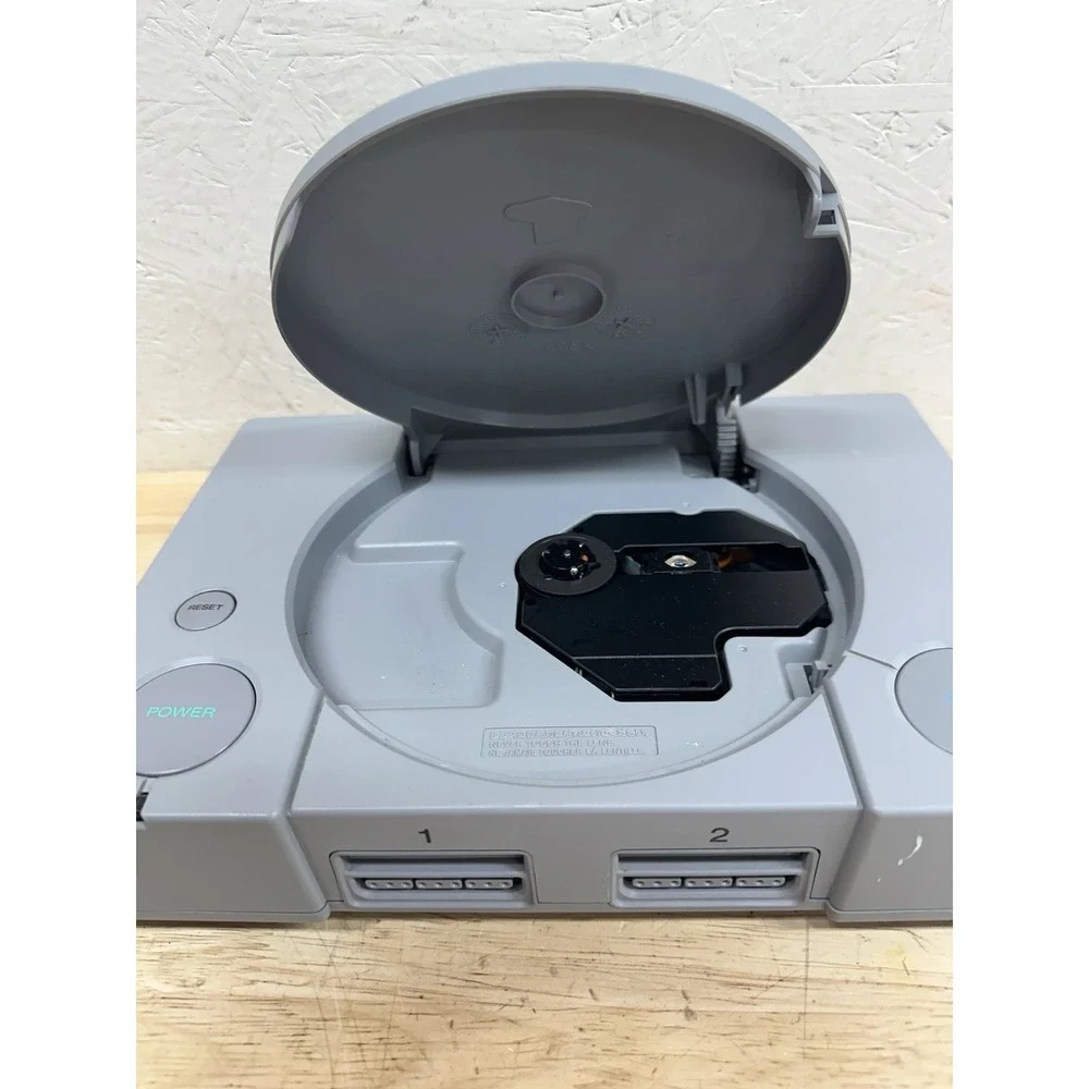 Sony PlayStation Console with DualShock Controllers Cables 4 Games SCPH-7501